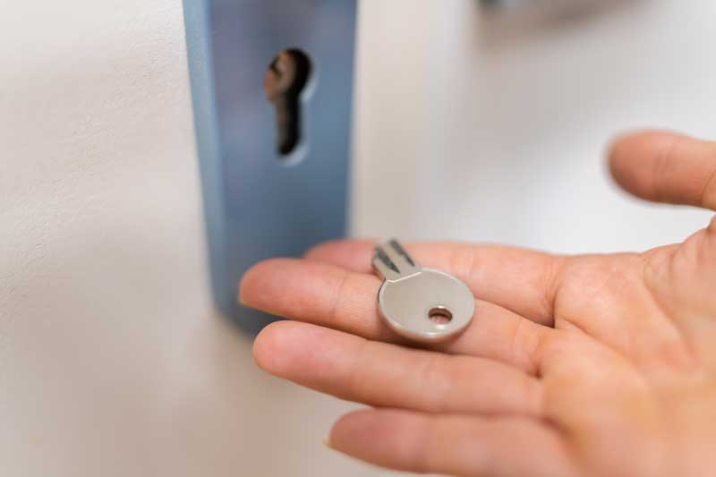 Hand holding broken key