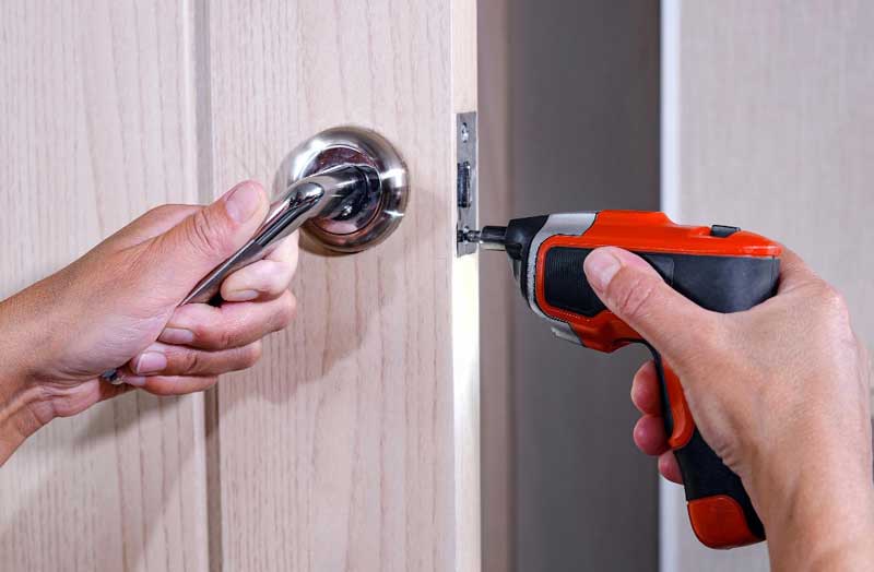 Screwdriver removing door latch